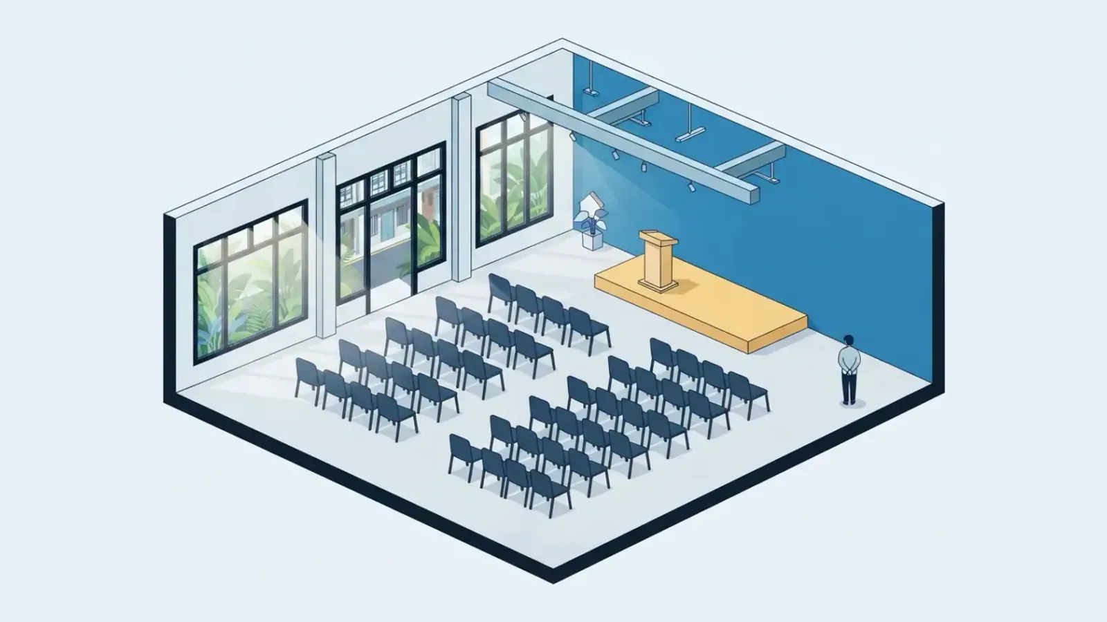 An empty event space in a shophouse with chairs arranged and an elevated platform.